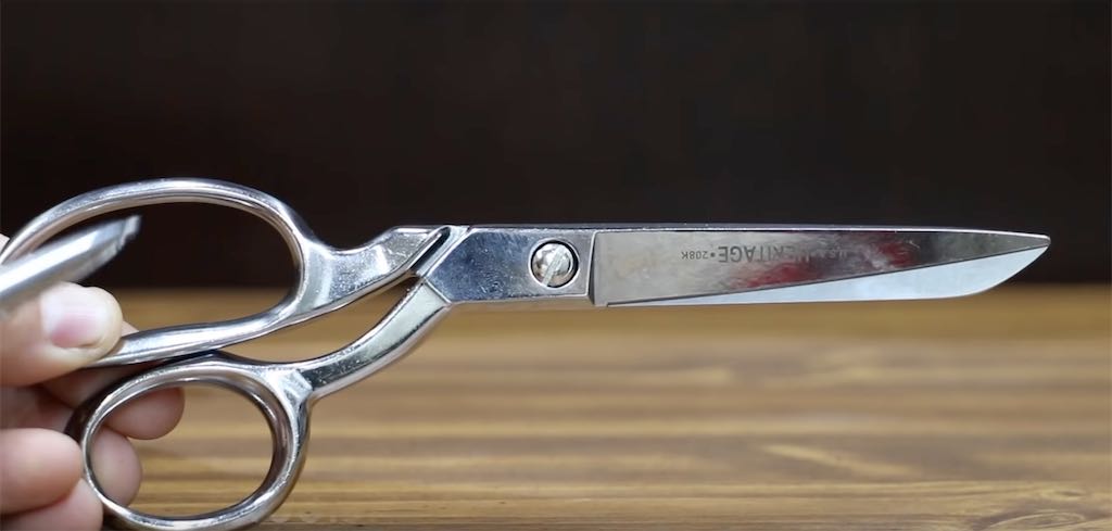 Klein brand scissors held in a hand